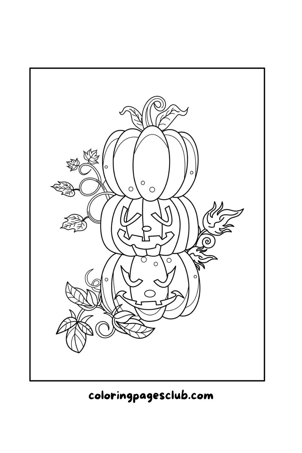 stack of pumpkins with fall leaves